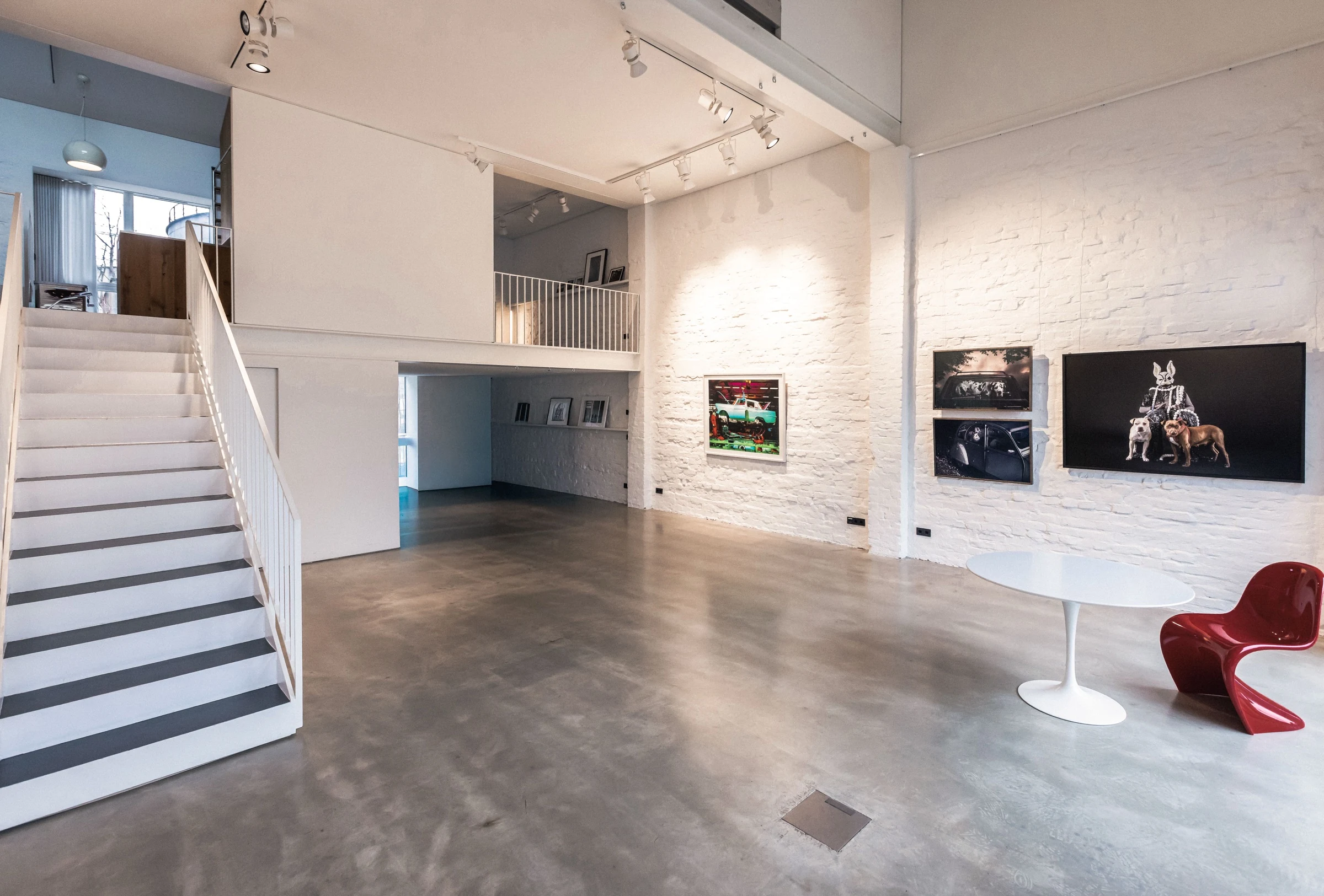 Ground floor hall with stairs and gallery wall